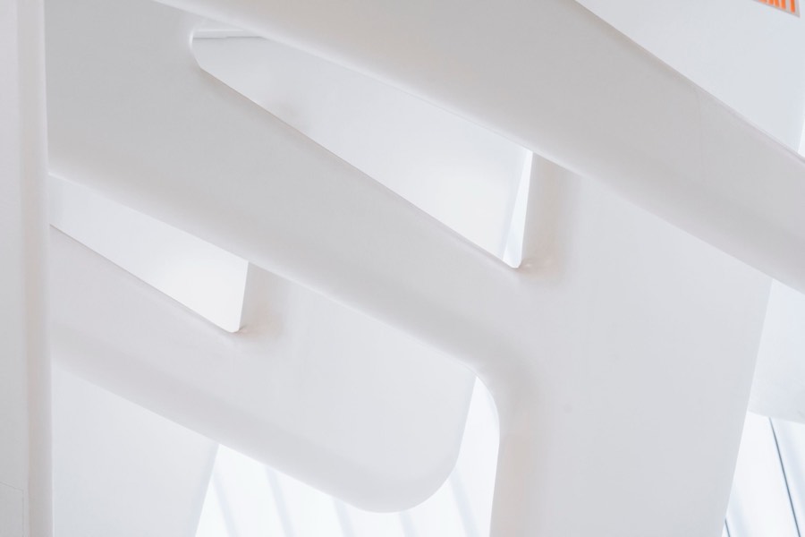 White stairwell with geometric daylight
